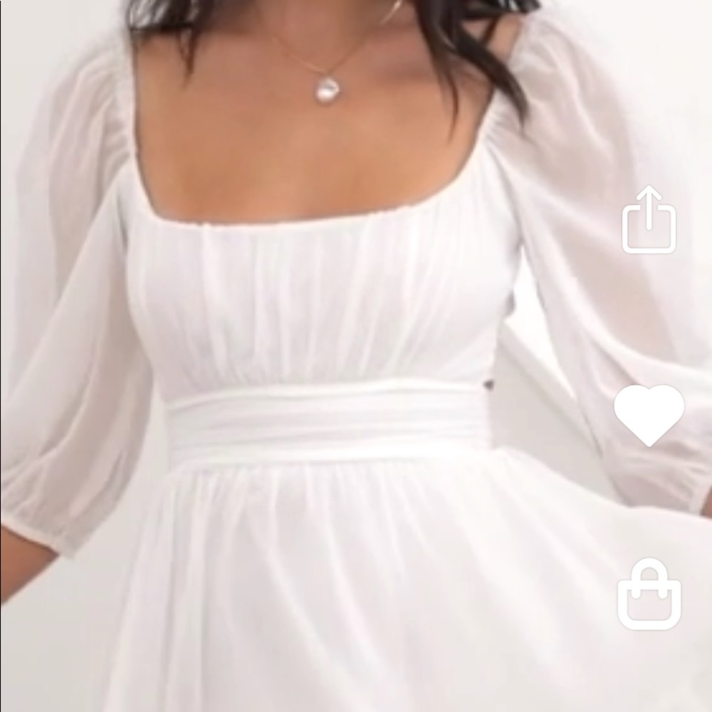 Brand new never worn dress from Lucy in the sky.  White with tie in back.